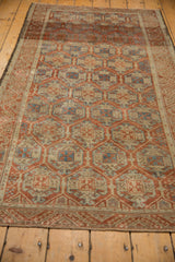 Distressed geometric pattern in madder red and sky blue, with visible foundation.