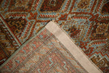Distressed vintage Belouch runner detail showing worn red, blue pile and hand-knotted back.