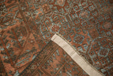 Distressed vintage Belouch rug's woven foundation and restored side selvage.