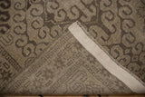 Distressed vintage Belouch rug showing hand-knotted foundation, intact selvage, and rams horn motif.