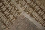Geometric distressed Belouch rug with low pile and tightly woven hand-knotted foundation.