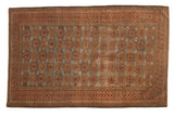 Vintage Distressed Belouch rug, faded floral pattern in dusty blue, madder red, and bronze, 3'5