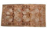 Distressed Belouch runner with bold double gul motifs and abrashed ground in browns, silver, and blush.