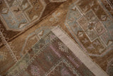 Intact side cord selvage and visible foundation on the distressed Belouch rug runner.