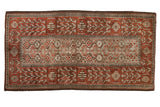 Distressed vintage Belouch rug featuring a silver geometric panel and wide madder red borders.