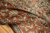 Pliable drape and lustrous low-pile texture of a vintage distressed Belouch rug.