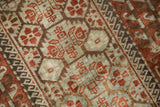 Detailed texture of a distressed Belouch rug with mostly even wear across the knot heads.