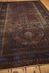 Antique Distressed Belouch rug lower border, madder red and sapphire blue geometric patterns, visible wear.