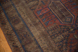 Antique Distressed Belouch rug pile, with visible foundation and sapphire blue banding.