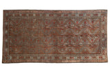 Distressed vintage Belouch rug featuring chestnut, slate blue, brick red geometric patterns, 3'4
