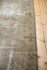 Vintage distressed Hamadan runner, showing faded terracotta geometric motifs and wear.