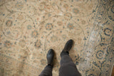 Vintage distressed Kashan carpet, ivory field with sprawling faded floral vinery.