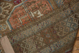 Vintage distressed Belouch runner foundation and worn pile, showing muted brown, blush, and blue tones.