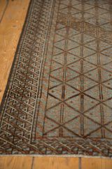 Distressed vintage Belouch runner, geometric lattice pattern, soft powder blue, wide wave border.