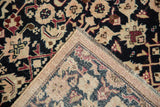 Distressed vintage Karabagh runner corner, revealing worn navy Herati pile and woven foundation.