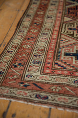 Geometric Moghan style pattern on a distressed Malayer runner with terra cotta and sapphire blues.