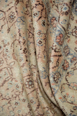Textured distressed Kayseri rug pile with muted peach, blue, and beige floral vinery.
