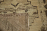 Vintage distressed Oushak rug runner, folded corner revealing hand knotted back and low-pile geometric design.