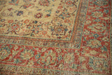 Low-pile texture on the cherry red and sky blue floral border of a vintage distressed Tabriz carpet.