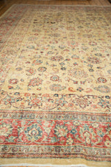 Low-angle perspective highlighting the worn, low-pile texture of a vintage Tabriz carpet.
