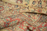 Detailed texture of a distressed Tabriz carpet with even wear to knot heads and cherry red floral vinery.
