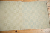 Distressed vintage Oushak runner: pastel mint green checkered pattern, heavy abrasions, and secured side.