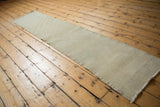 Distressed vintage Oushak runner showcasing soft tone-on-tone abrashes and pale checkered motif.