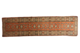 Vintage distressed hand-knotted Dosemealti runner with rust and ivory geometric floral pattern.