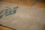 Reverse view of the vintage Oushak rug, revealing its hand-knotted construction and natural foundation.