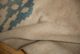 Natural beige hand knotted foundation of the vintage Turkish Oushak rug runner.