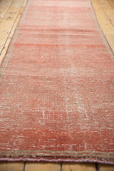 Vintage Distressed Oushak rug runner showing textural abrashes, faded raspberry, and deep blush tones.