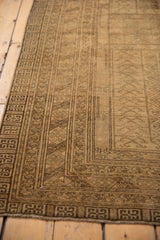 Distressed Turkmen rug texture and border detail with even wear, geometric, and crab-style patterns.