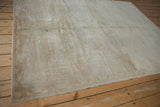 Hand knotted vintage distressed Oushak rug corner with pale blush germinating plant border.