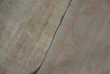 Distressed vintage Oushak pile texture and tight hand-knotted foundation with pale blush lines.