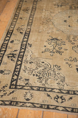 Even wear on a distressed vintage Sivas rug, showing faded beige pile and intricate charcoal patterns.