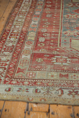 Vintage distressed Caucasian carpet side border with geometric patterns, cherry red, denim blue, and original selvage.