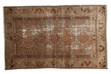 Distressed Malayer rug, central medallion, worn pile revealing foundation, earthy tones, 4'5