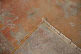 Hand-knotted foundation, intact selvage, and distressed terra cotta Khotan pile with fringe.