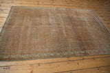 Vintage Distressed Serbend rug end with time-softened terra cotta, charcoal, and ivory border motifs.
