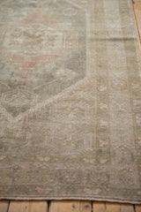 Distressed Oushak runner texture with even wear to knot heads and intact side selvage.
