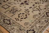 Even wear to the knot heads on a vintage Persian Malayer rug with brown starburst designs.
