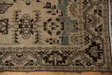 Evenly worn texture on the hand-knotted geometric border of a vintage Malayer rug.