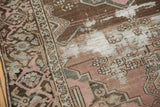 Distressed pile of the vintage Malayer rug, revealing foundation and soft mauve tones.