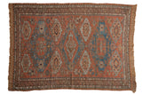 Antique Soumac carpet, multi-medallion field with geometric guls in madder red and sky blue.