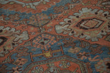 Geometric guls and distressed texture on a Caucasian Soumac rug in madder red and sky blue.