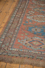 Fringe and geometric wave border of an antique Caucasian Soumac carpet in red and blue.