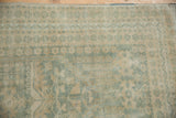 Distressed texture and even wear of vintage Oushak rug with seafoam green patterns.