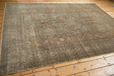 Distressed Sivas carpet corner showing even wear and subtle geometric and floral motifs.