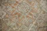 Distressed vintage Sivas carpet with geometric patterns in coffee brown and antique ivory.