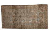 Distressed Belouch runner, geometric gul motifs, abrashed field in silver, platinum, and pale copper.